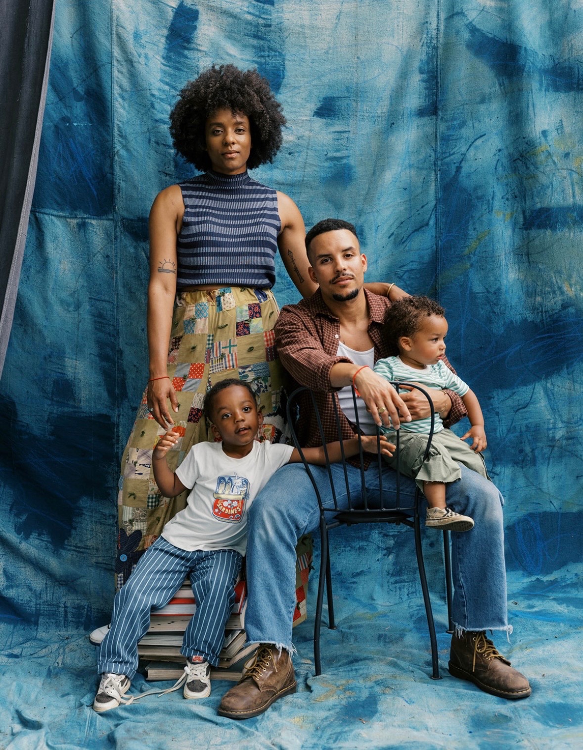 The Mowry family seated together with their two sons